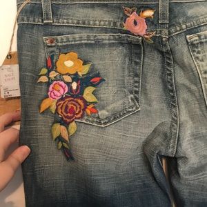 Bootcut jeans with embroidered floral designs